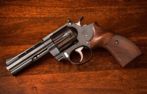 Korth Combat .357 Magnum revolver with 4-inch barrel on a walnut table