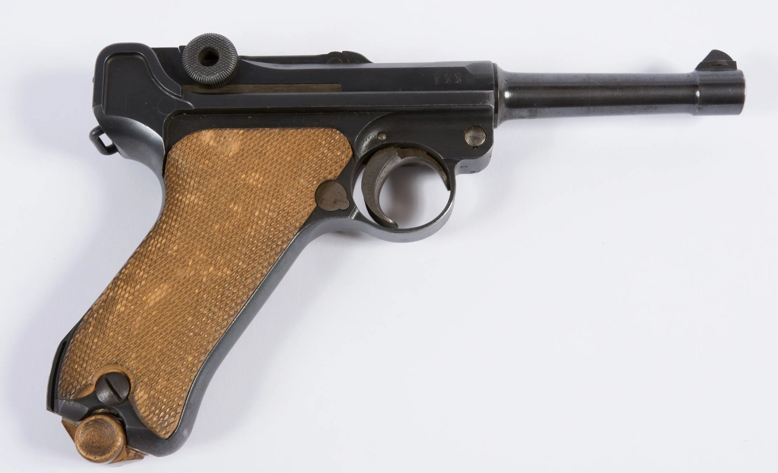 WWI Luger P08 pistol made by DWM in 1918, left side, with wooden grips