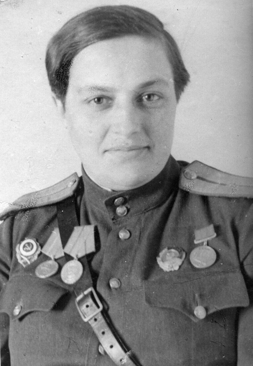 Portrait of Lyudmila Pavlichenko in Red Army uniform with her medals, 1943