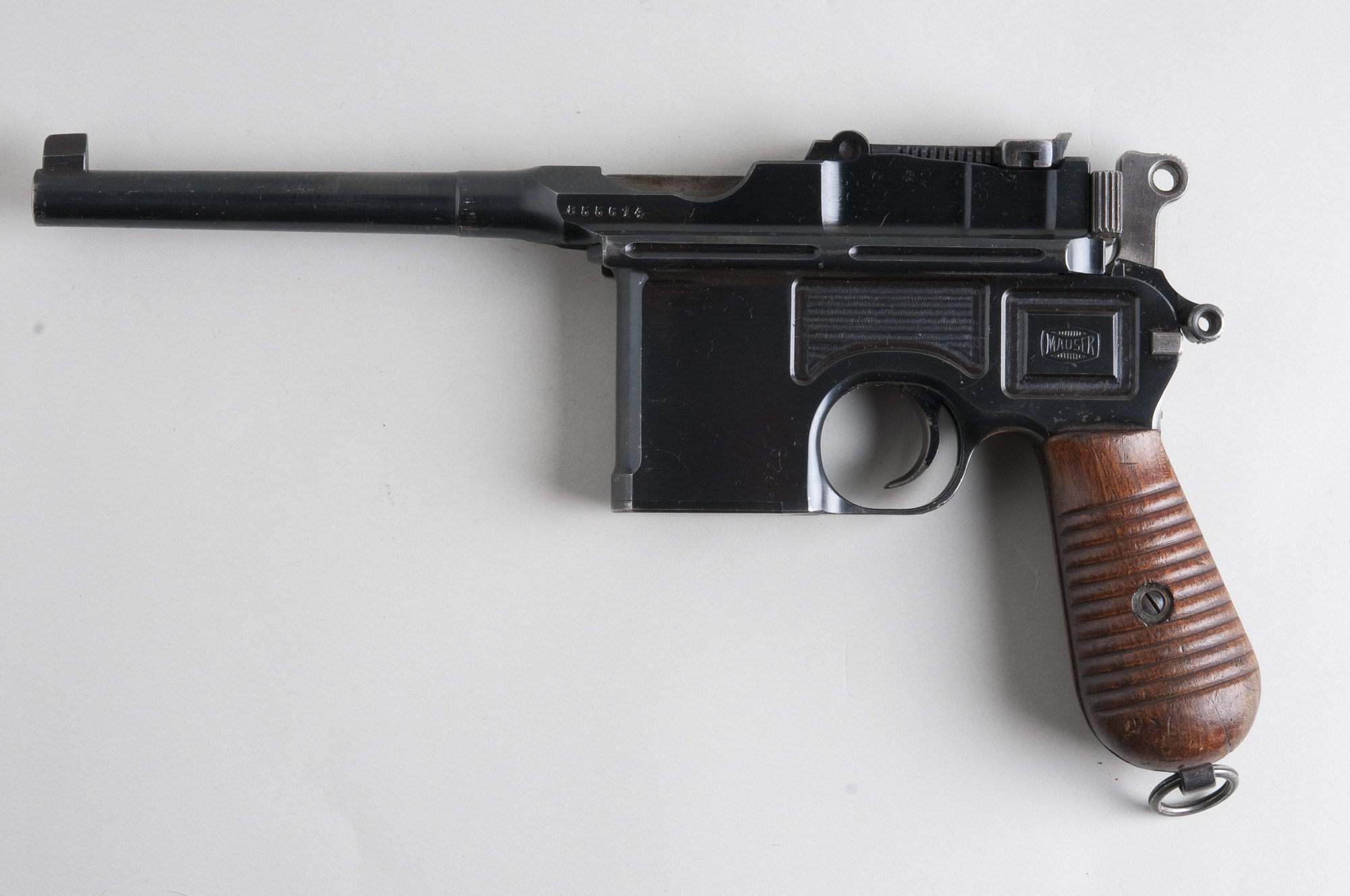 Mauser C96 Broomhandle pistol in 7.63 mm, left side, deep blued finish with ribbed walnut grips and lanyard ring