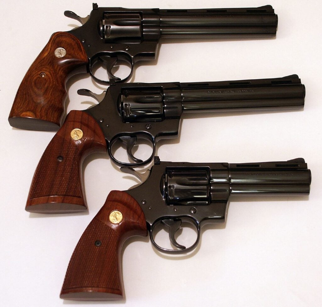 Three original blued Colt Python .357 Magnum revolvers with walnut grips