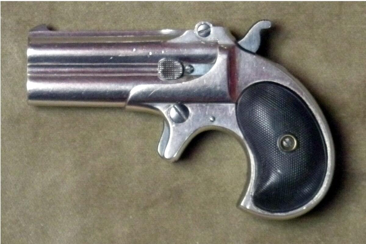 Nickel-plated Remington over-and-under double derringer in .41 rimfire