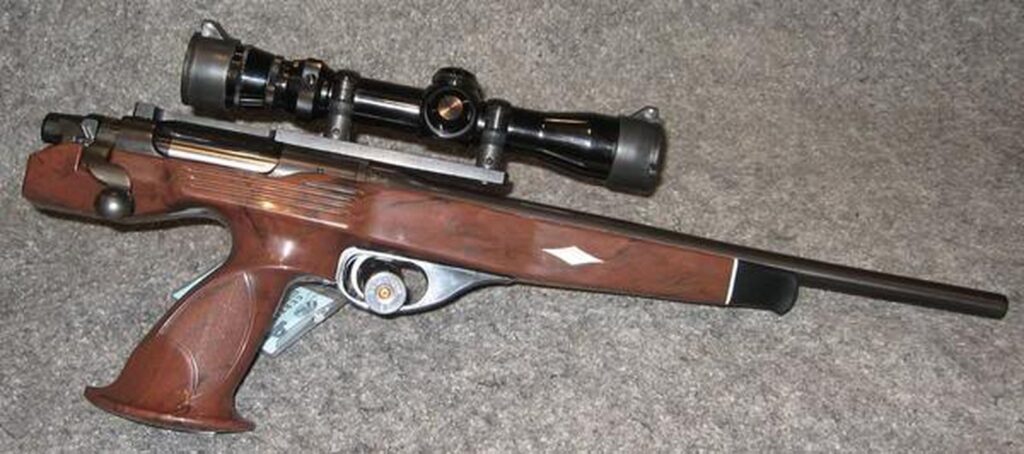 Remington XP-100 bolt-action pistol with its center-grip nylon stock and a scope