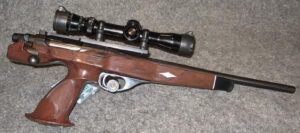 Remington XP-100 bolt-action pistol with its center-grip nylon stock and a scope