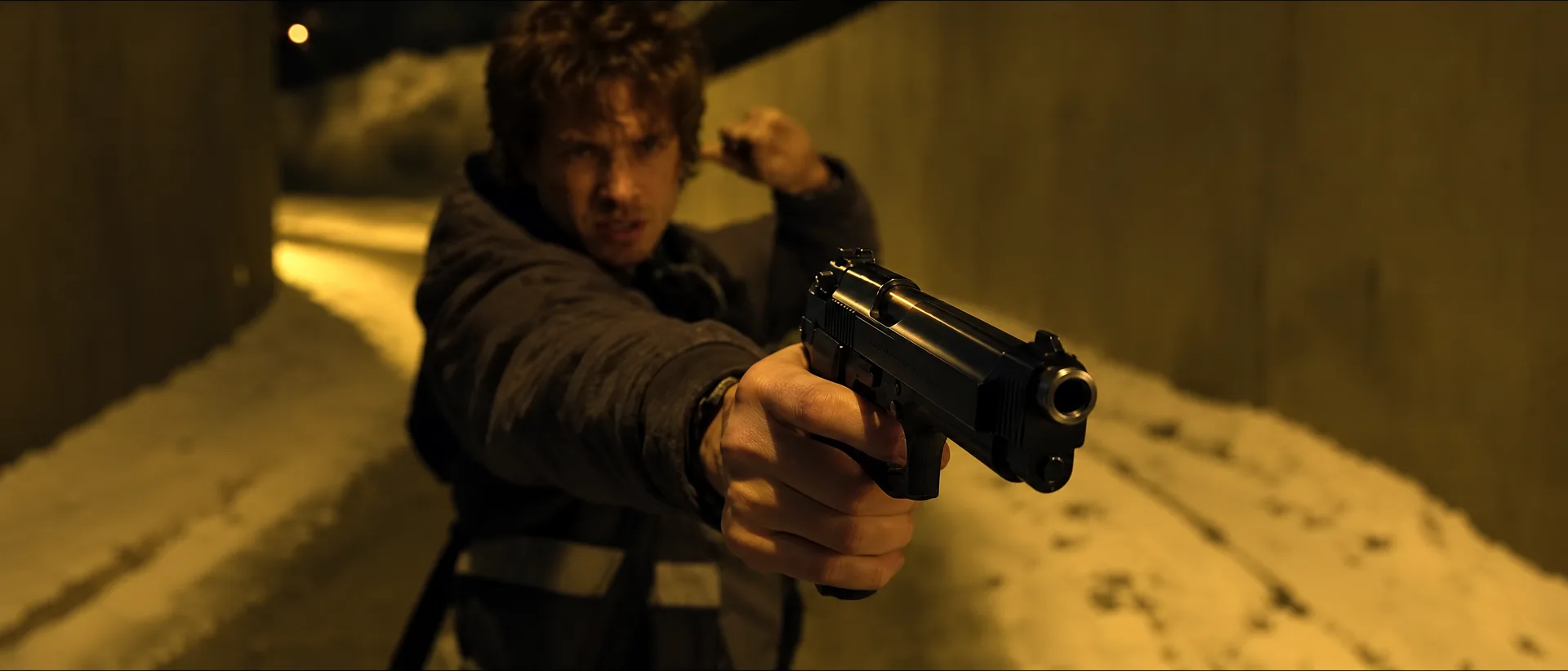 Resident Evil 2026 guns: Bryan Hodukavich aiming the Beretta 92FS, remastered film still