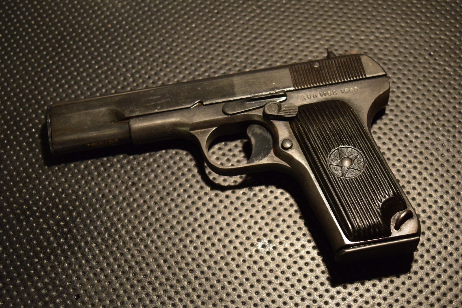 Left side of a 1953 Romanian TTC Tokarev pistol made at Cugir, showing the safety lever behind the slide stop