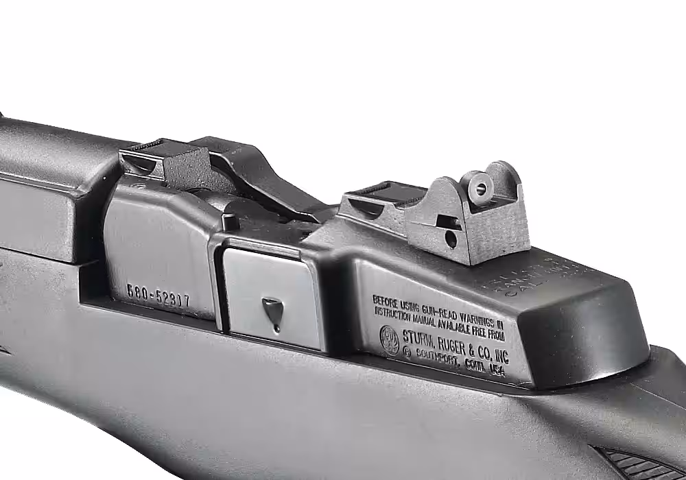 Close-up of the integral scope mounts and ghost ring rear sight on a stainless Ruger Mini Thirty receiver
