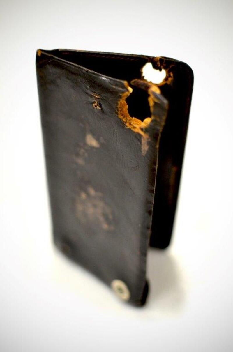 Leather notebook belonging to Barker-Karpis gang member Russell Gibson with a bullet hole through it, from the FBI collection