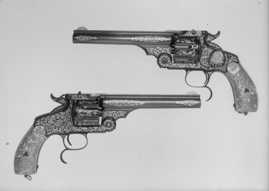 Two engraved Smith & Wesson New Model No. 3 top-break revolvers, the Schofield family