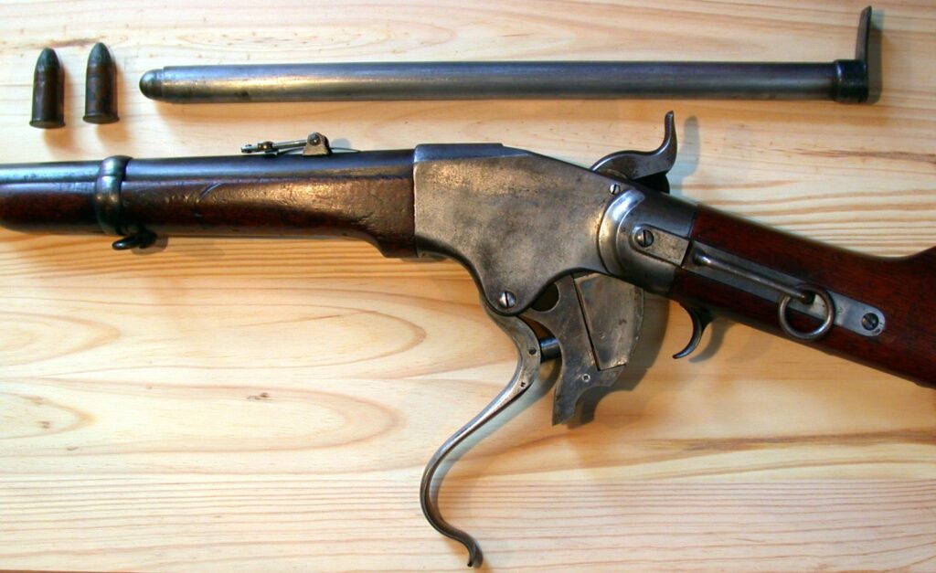 Spencer Model 1865 carbine with its tube magazine drawn out of the buttstock, one of the first guns ahead of their time