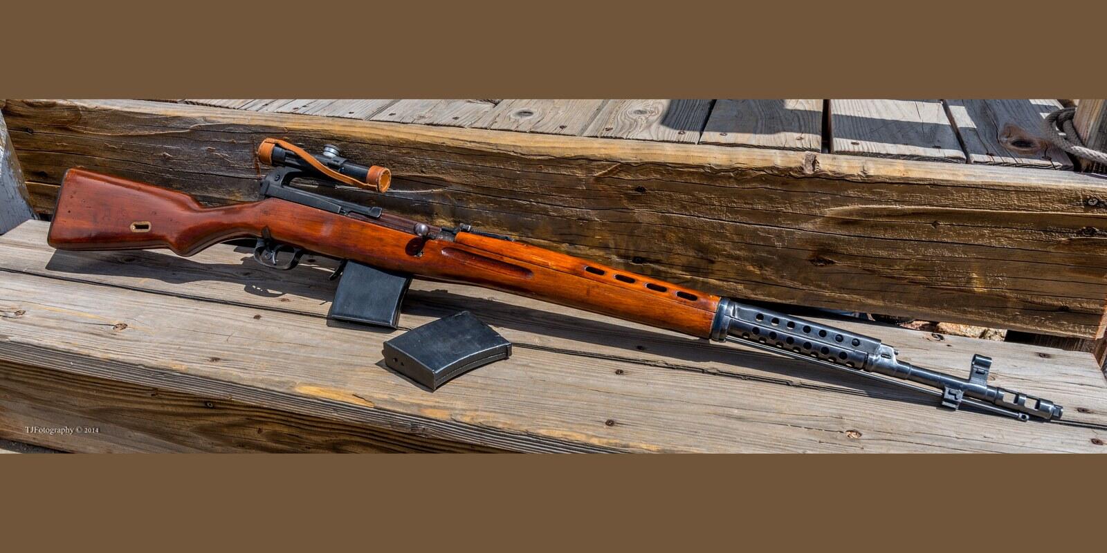Tula-made Tokarev SVT-40 semi-automatic rifle in sniper configuration with a scope mount and magazine