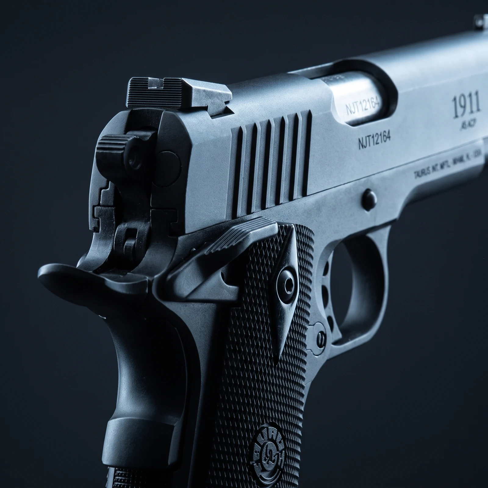 Close up of the Taurus 1911 rear sight, hammer and beavertail grip safety