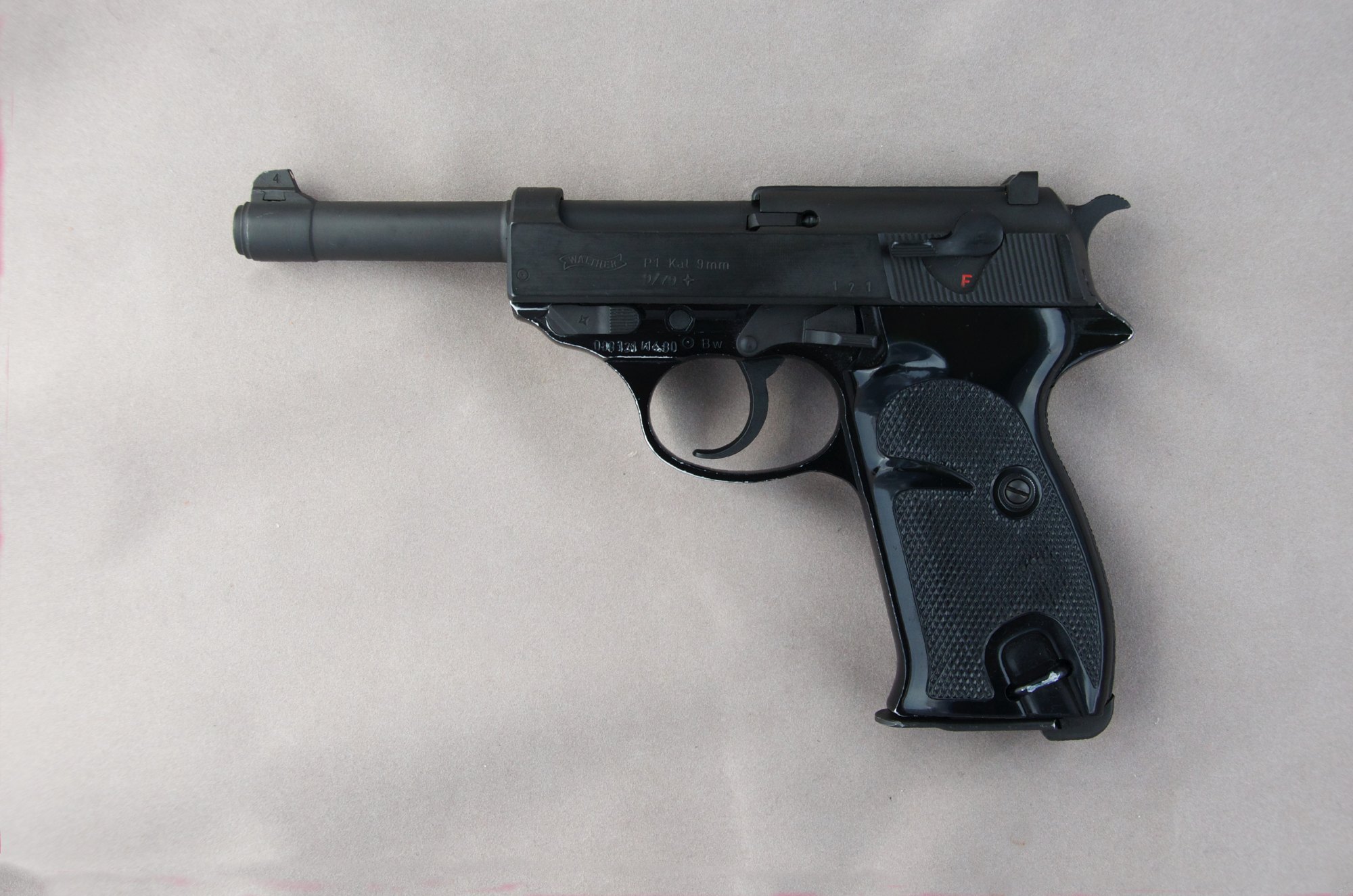 Postwar Walther P1 pistol, left side, black alloy frame with checkered grips and hex reinforcing bolt