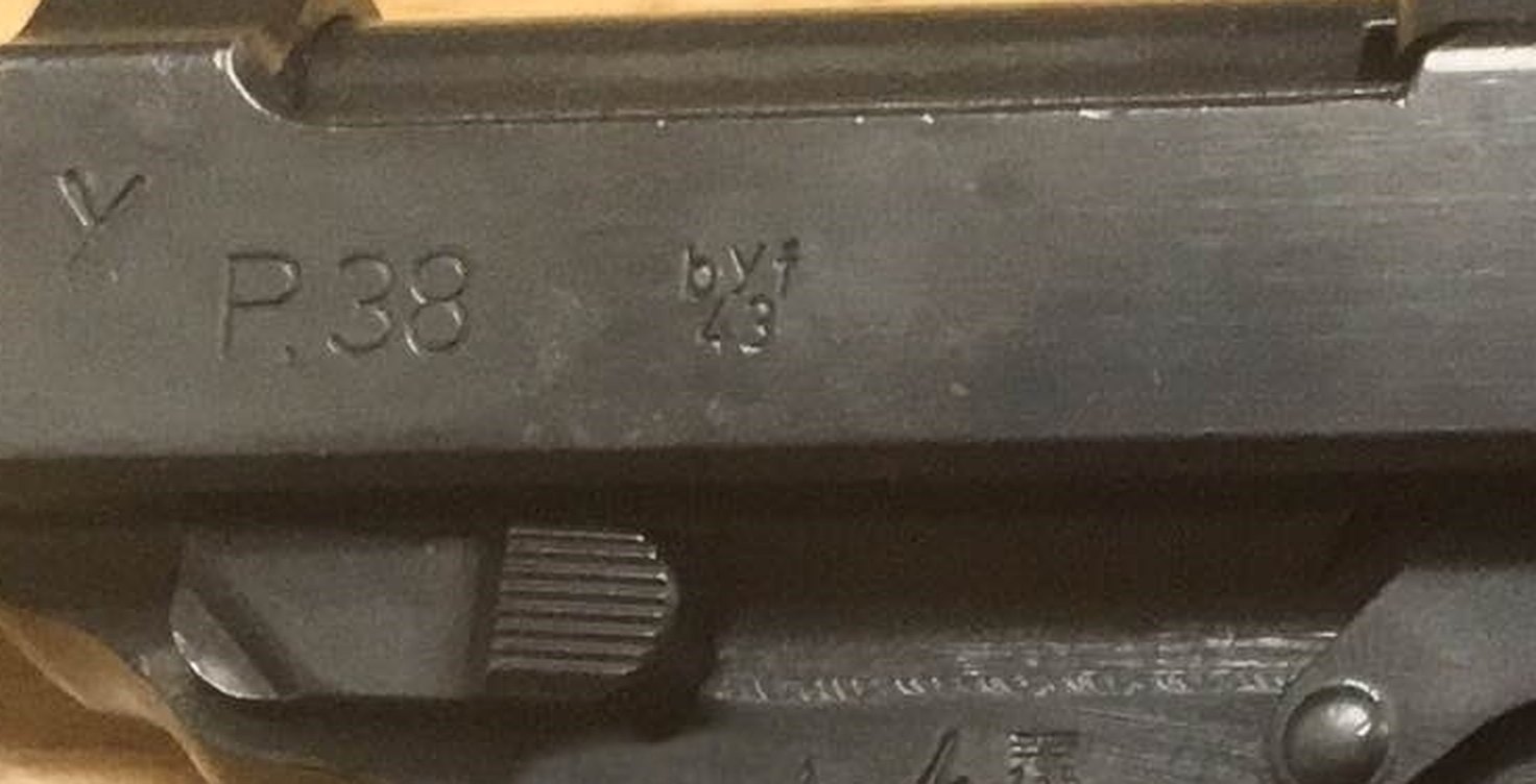 Close-up of a P38 slide stamped P.38 with the Mauser code byf over the year 43