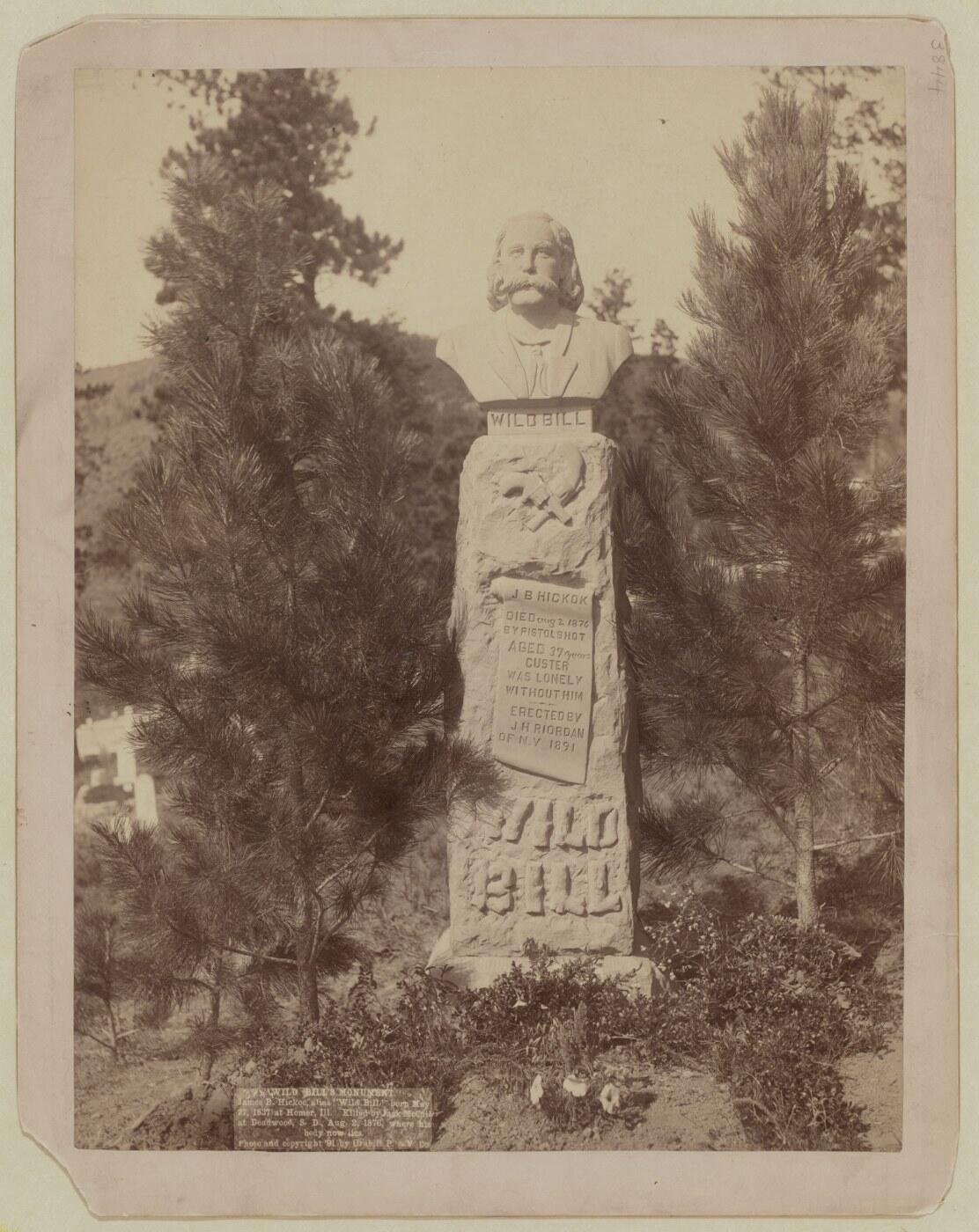 Monument with a bust over Wild Bill Hickok's grave at Mount Moriah Cemetery in Deadwood, South Dakota, photographed by John C. H. Grabill