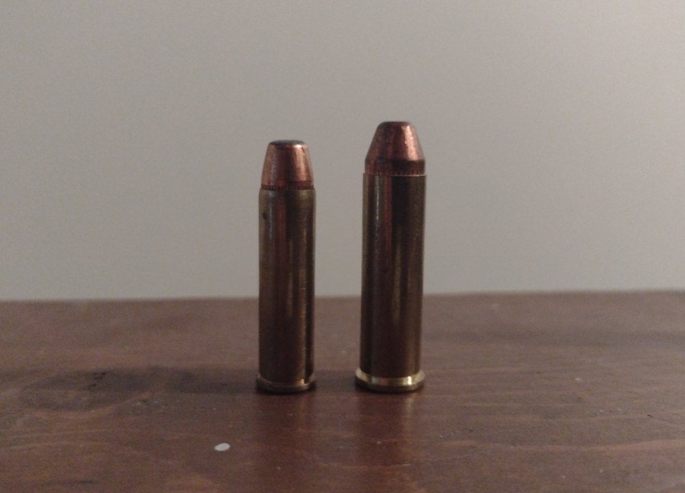 327 Federal Magnum cartridge beside a 357 Magnum cartridge