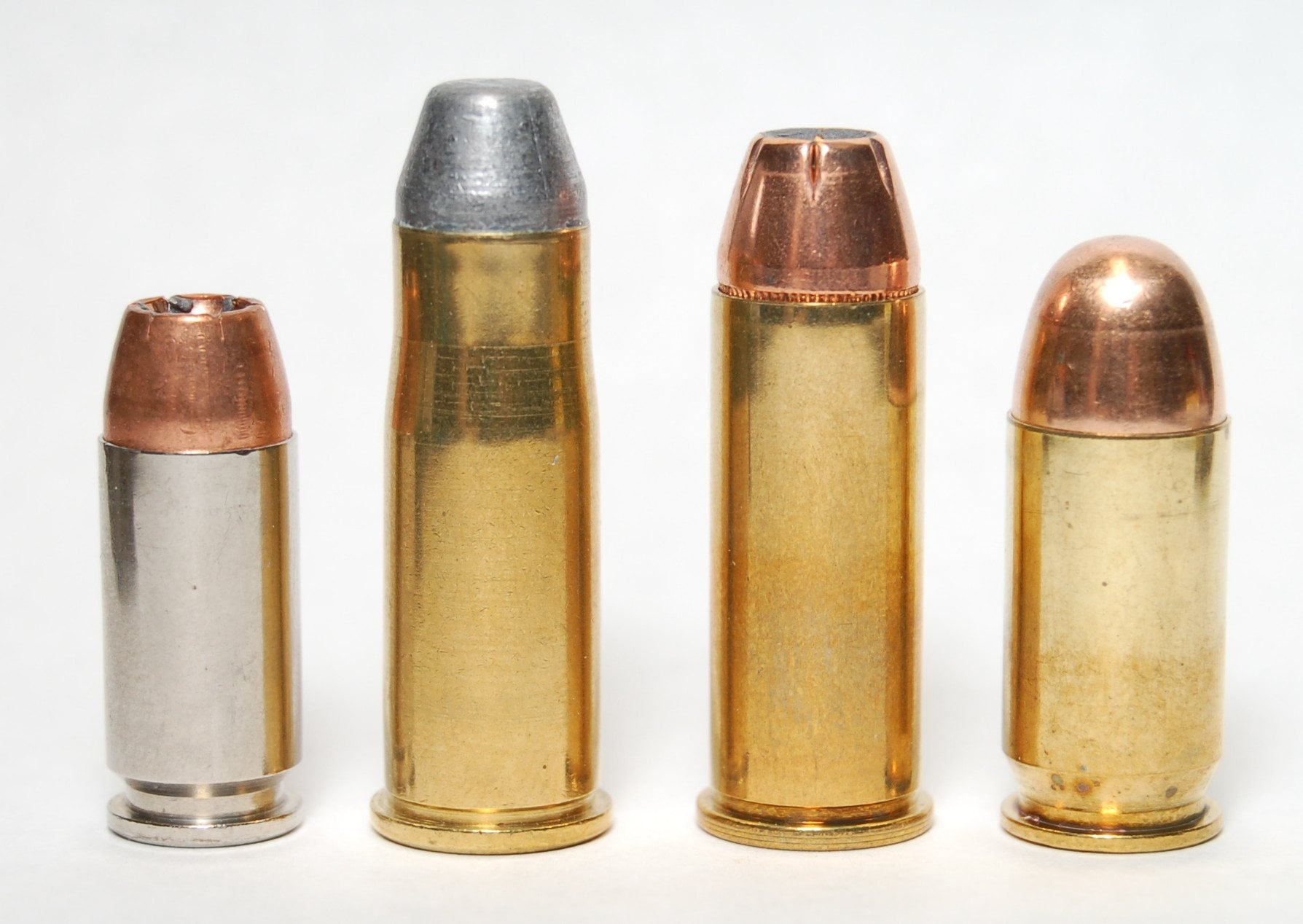 40 S&W, 38-40, 44 Special and 45 ACP cartridges standing in a row
