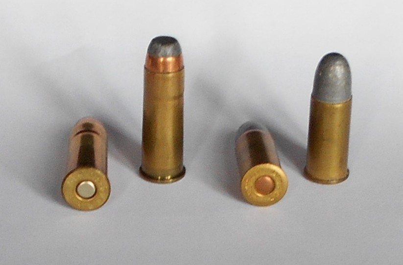 44-40 Winchester cartridges beside shorter .44 Russian cartridges