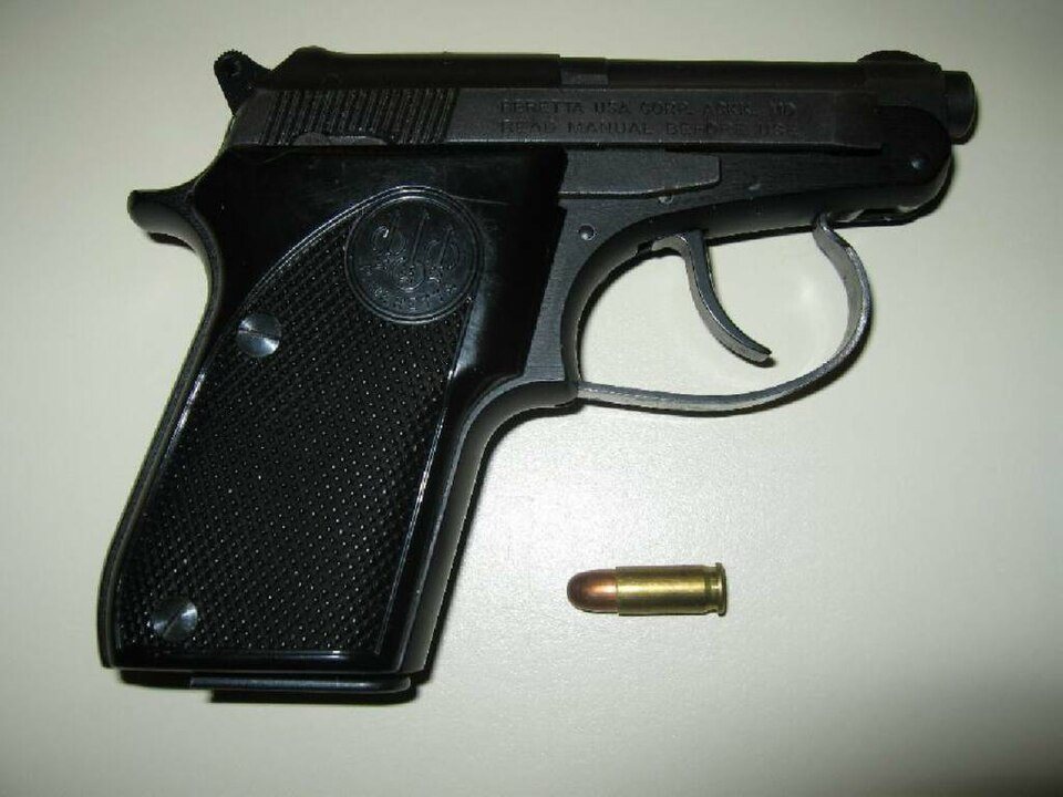 Black Beretta Model 21A Bobcat pistol in 25 ACP with one cartridge in front