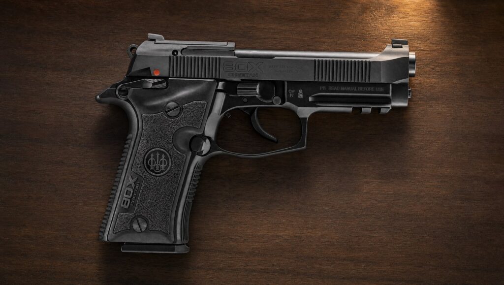 Beretta 80X Cheetah .380 pistol lying flat on a dark walnut nightstand under warm lamp light, right side showing the 80X Cheetah slide marking, exposed hammer and accessory rail