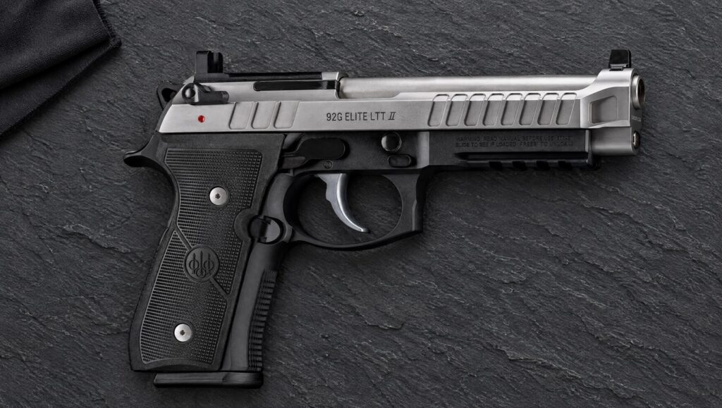 Beretta 92G Elite LTT II with stainless Inox slide, black frame and rail lying flat on dark slate