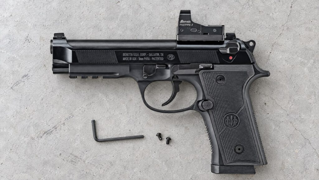Beretta 92X RDO Full Size with straight Vertec backstrap, rail and a Burris FastFire 3 on the optic cut lying flat on a concrete workbench