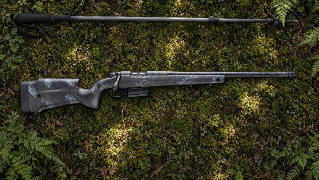 Bergara B-14 Squared Crest Carbon with carbon fiber stock and CURE carbon barrel lying flat on a mossy forest floor