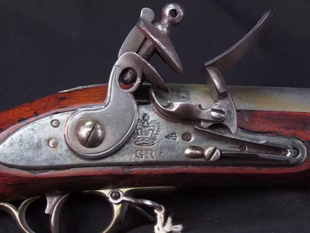 Lock of an original second model Brown Bess musket with a crown over GR, Smithsonian collection