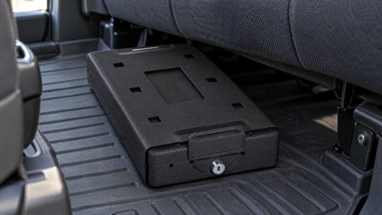 Bulldog Car Vault steel lock box on the floor of a pickup truck cab under the rear seat