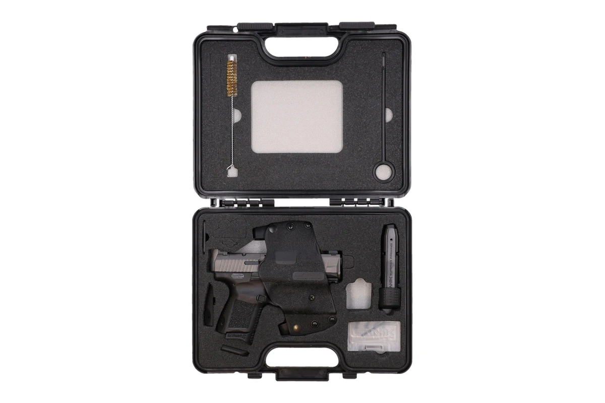 Canik TP9 Elite SC in its case with the included holster, magazine loader and two magazines
