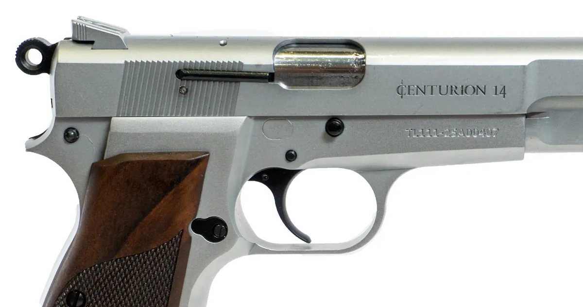 Close-up of the chrome Century Arms Centurion 14 showing the Centurion 14 slide marking, skeleton hammer, slide serrations and checkered wood grip, Century Arms photo