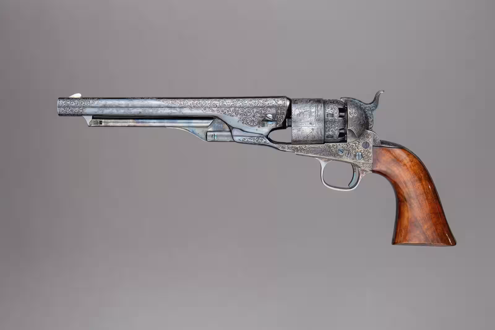 An engraved Colt Model 1860 Army percussion revolver with a blued barrel and walnut grip, serial number 7569, photographed by The Metropolitan Museum of Art