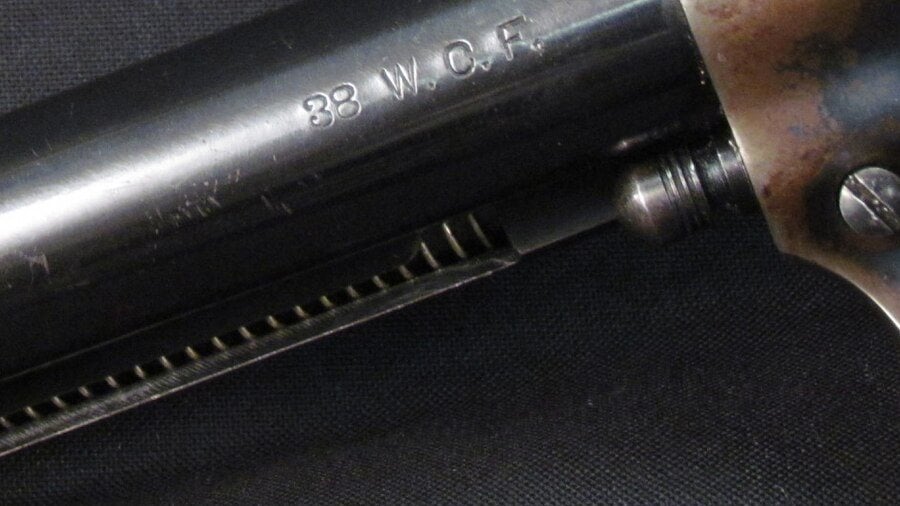 38 W.C.F. stamp on the barrel of a Colt Single Action Army revolver