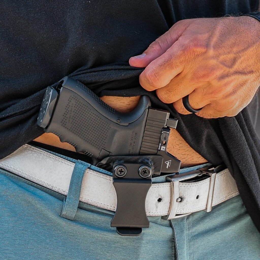 Concealment Express IWB holster worn inside the waistband with a Glock and red dot