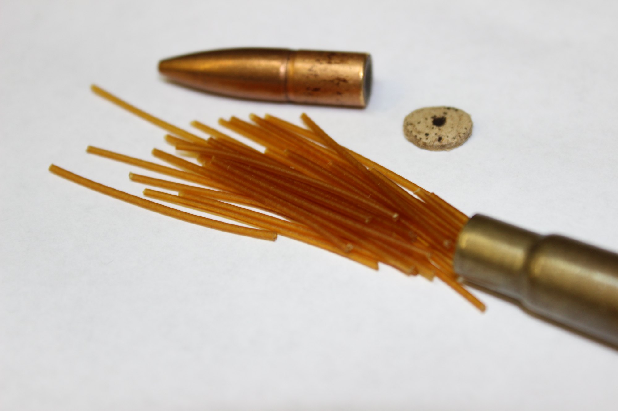 Cordite strands spilling out of a pulled 303 British military cartridge