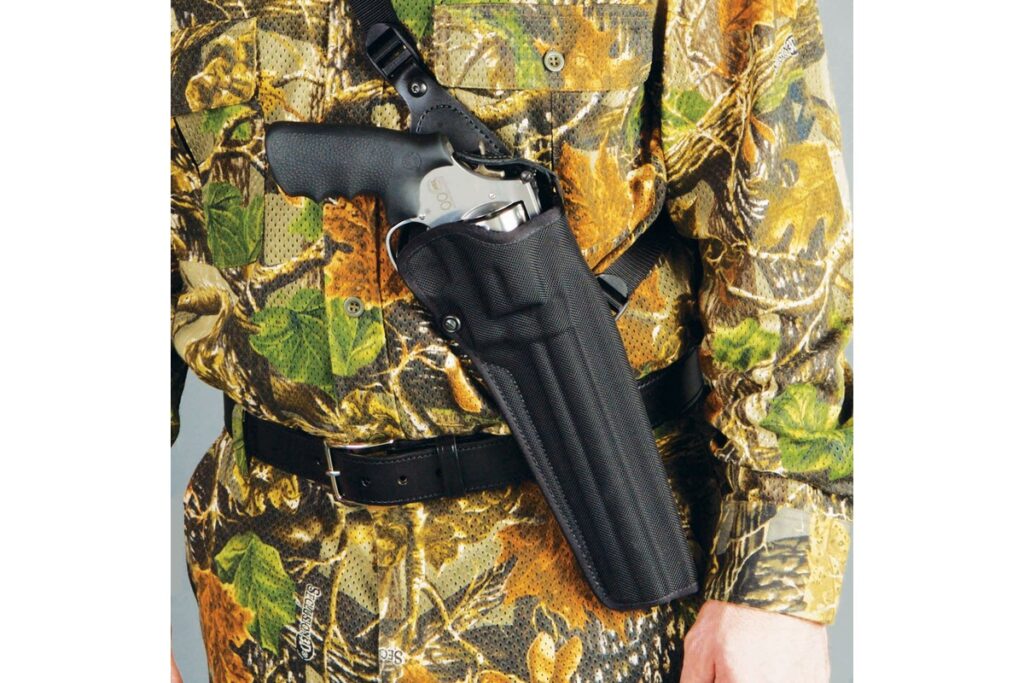 DeSantis Black Mamba molded nylon chest holster carrying a large Smith and Wesson revolver