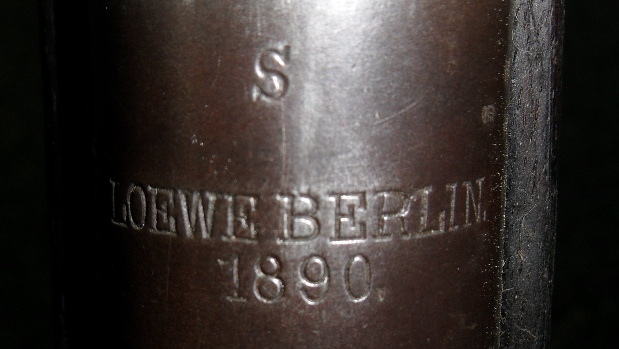 S stamp above Loewe Berlin 1890 on the receiver ring of a Gewehr 88 rifle