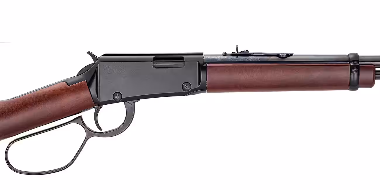 Close-up of a Henry H001L Large Loop receiver showing the black grooved receiver cover, the semi-buckhorn rear sight and the .22 S/L/LR barrel stamp, Henry photo