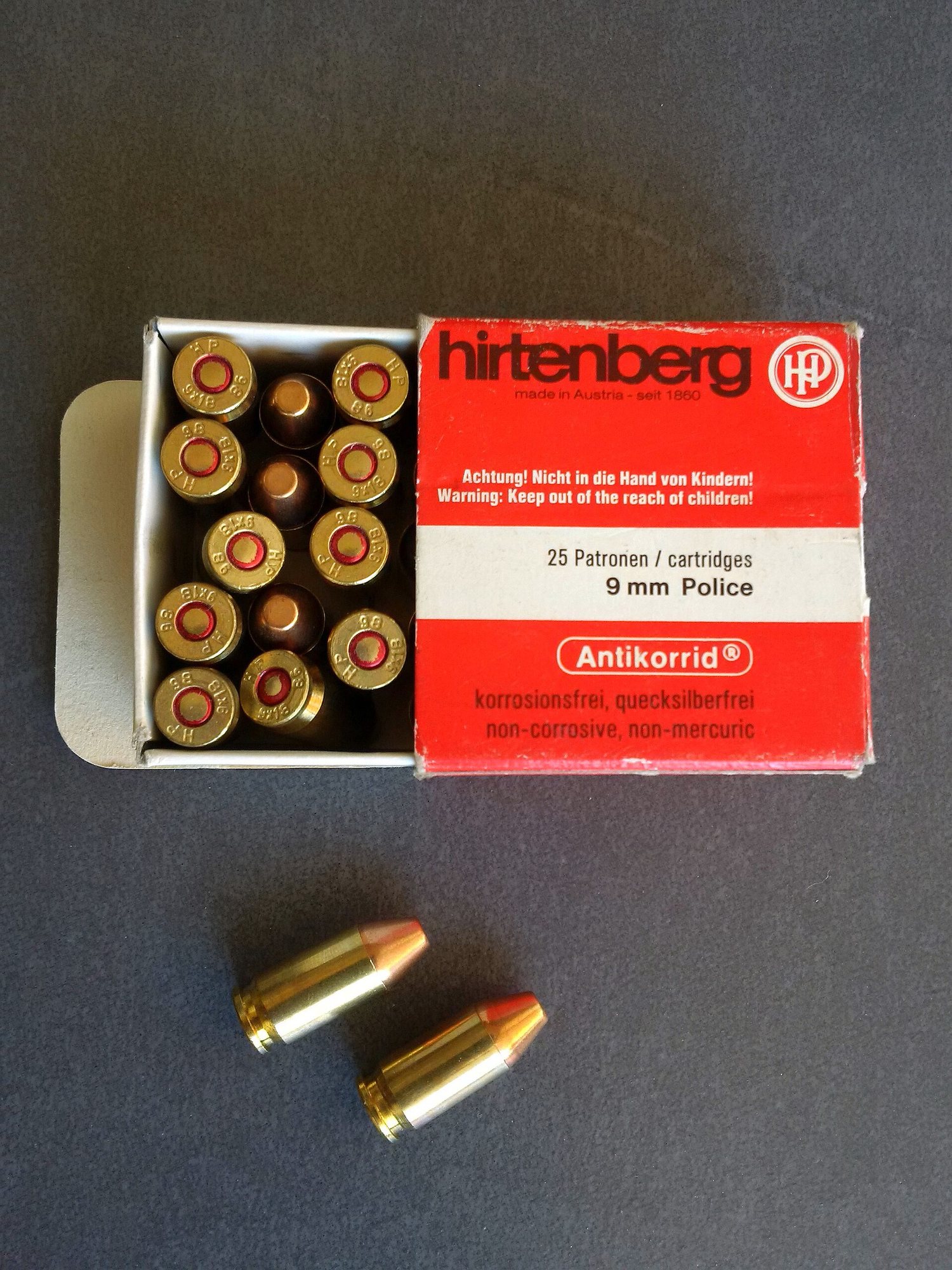Hirtenberg box of 9 mm Police cartridges, also called 9x18 Ultra, with loose rounds
