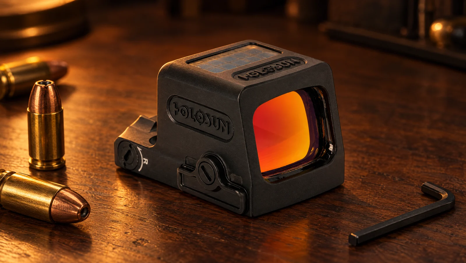Holosun EPS Carry enclosed red dot on a walnut workbench beside 9mm cartridges and a hex key