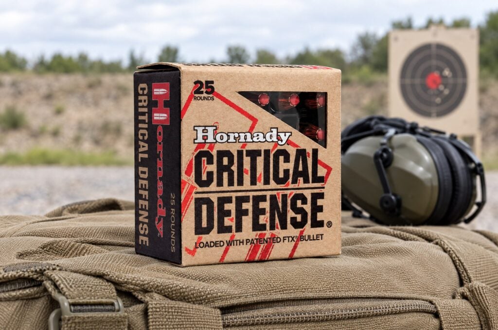 Hornady Critical Defense review: a 25 round box of FTX handgun ammo on a tan range bag at an outdoor range