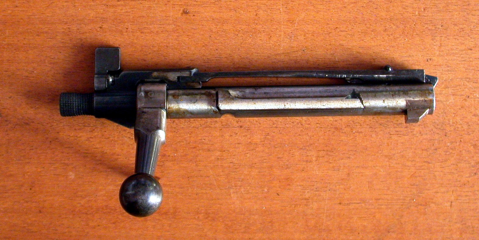 Krag-Jorgensen rifle bolt removed from the rifle, showing its single front locking lug