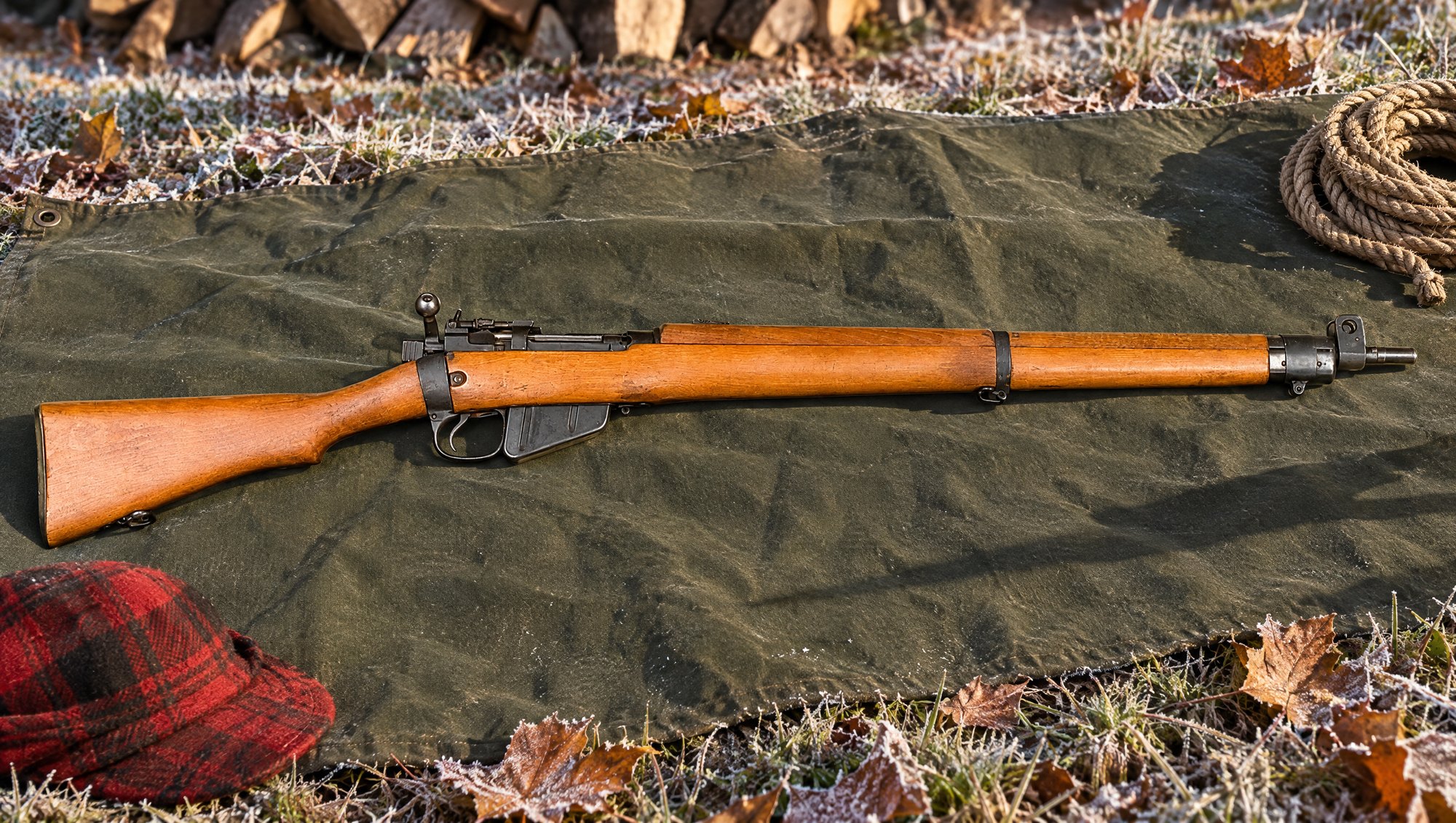 Lee-Enfield No. 4 Mk I rifle lying on a green canvas tarp at a hunting camp