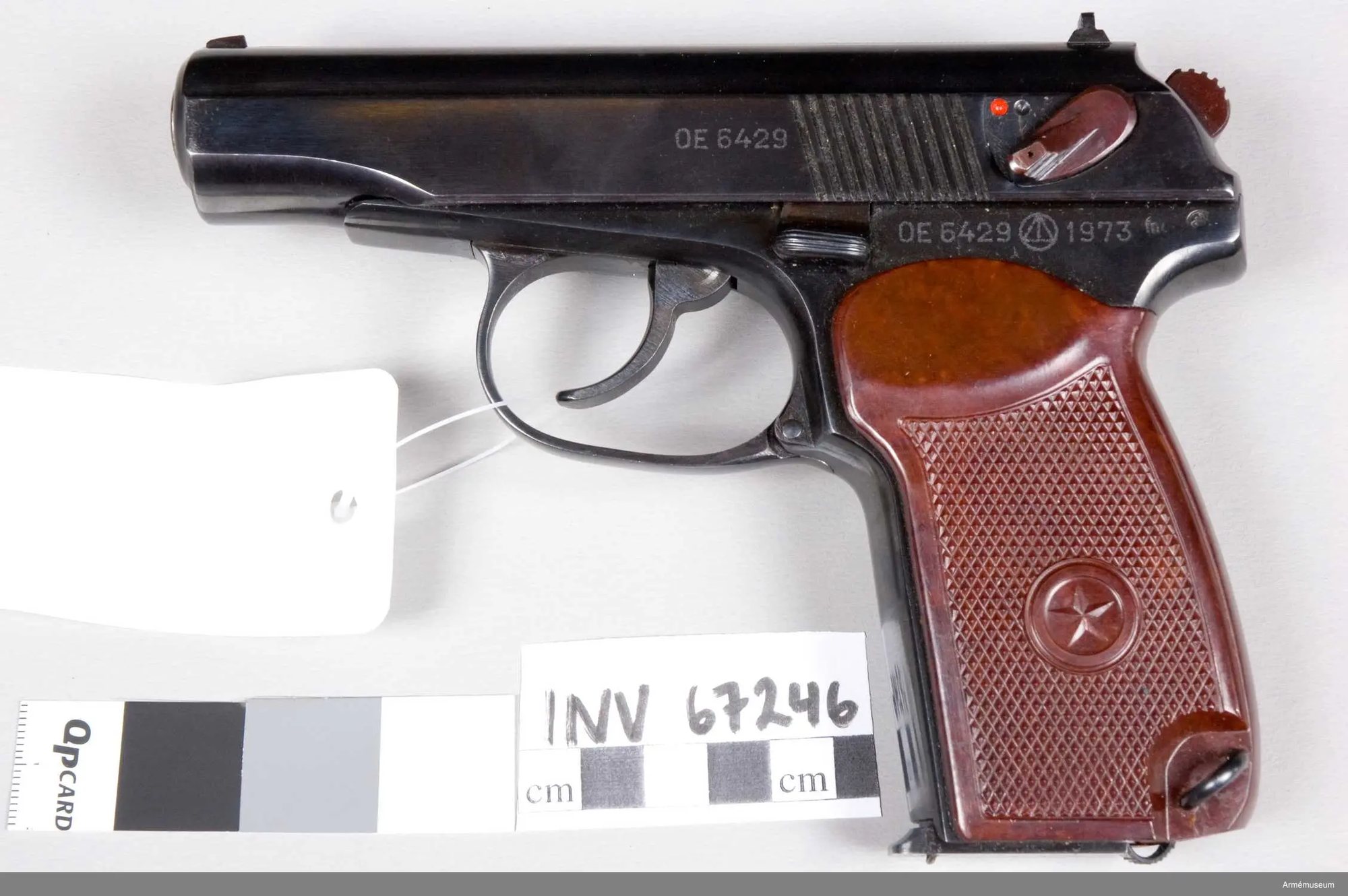 Soviet Makarov PM pistol from 1973, left side, with a museum tag