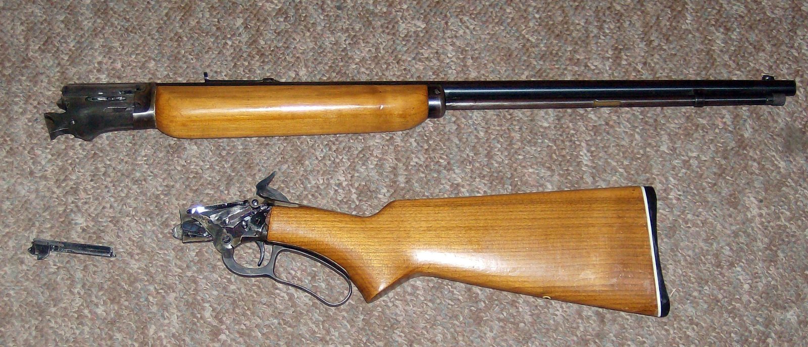 Marlin 39A rifle taken down into barrel and stock halves with the bolt removed