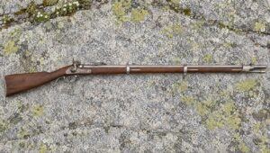Pedersoli 1857 Wurttembergischen percussion infantry rifle lying flat on a lichen-patched granite slab