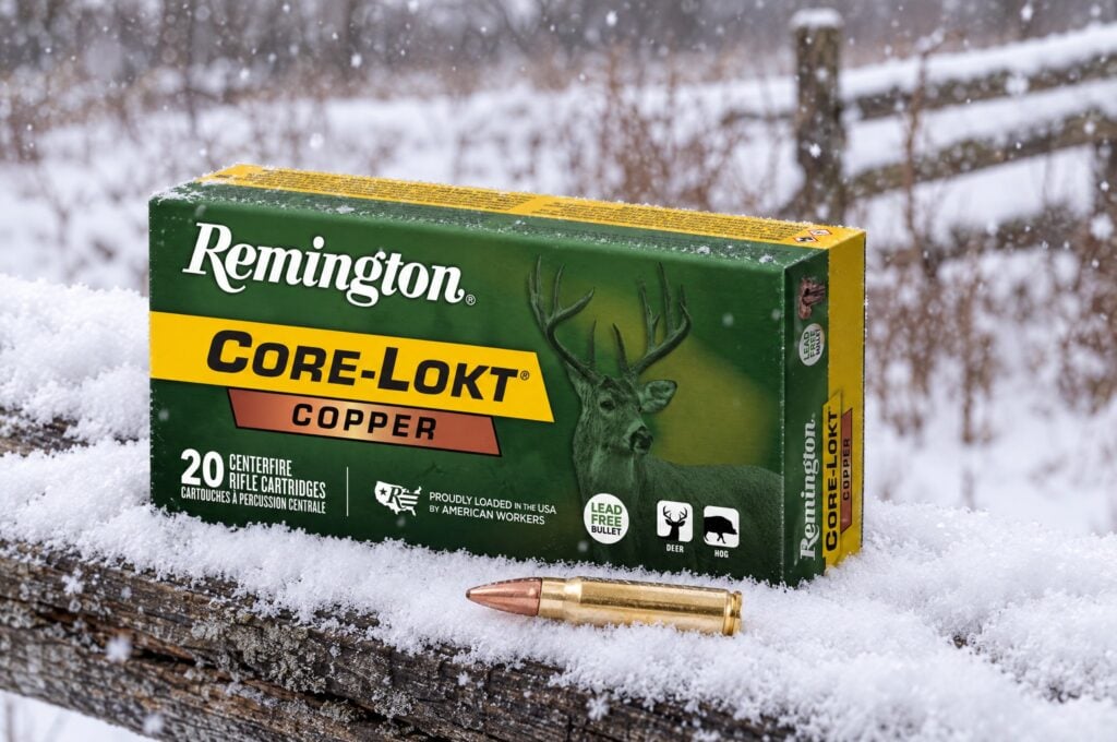 Remington Core-Lokt Copper 308 Win 150 grain lead free box and copper bullet cartridge on a snowy split rail fence