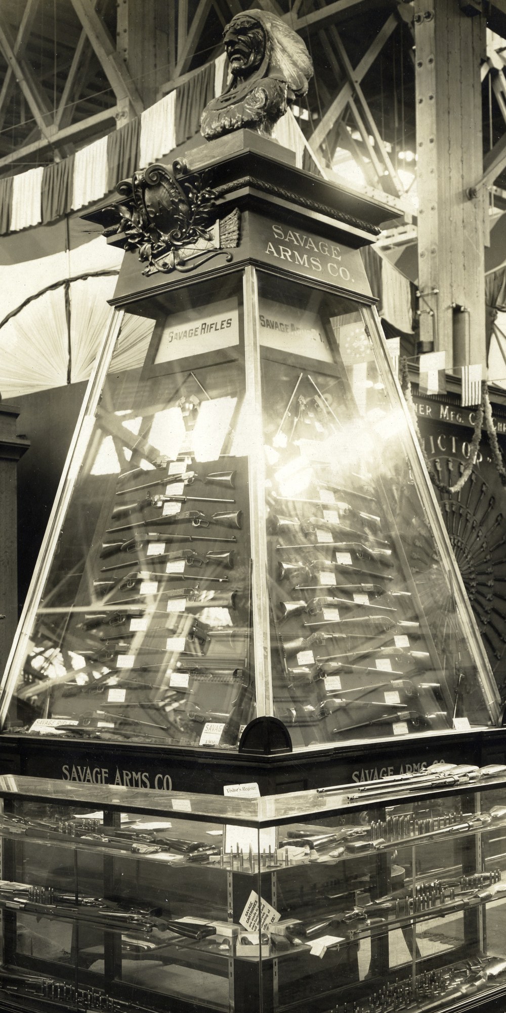 Savage Arms exhibit at the 1904 St. Louis World's Fair with a pyramid of rifles topped by an Indian-head bust