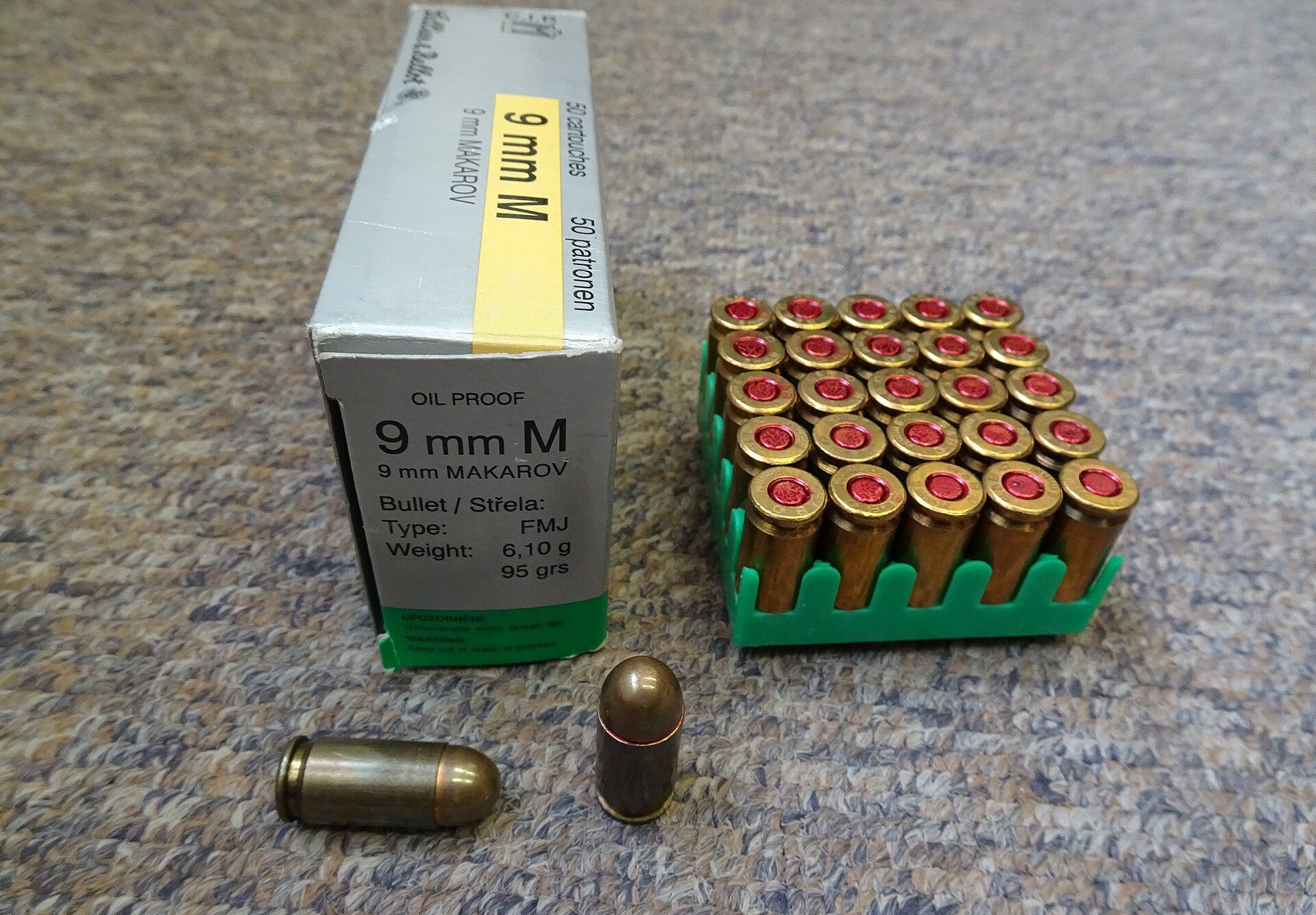 Sellier and Bellot box of 9x18 Makarov ammo with a tray of brass-case rounds