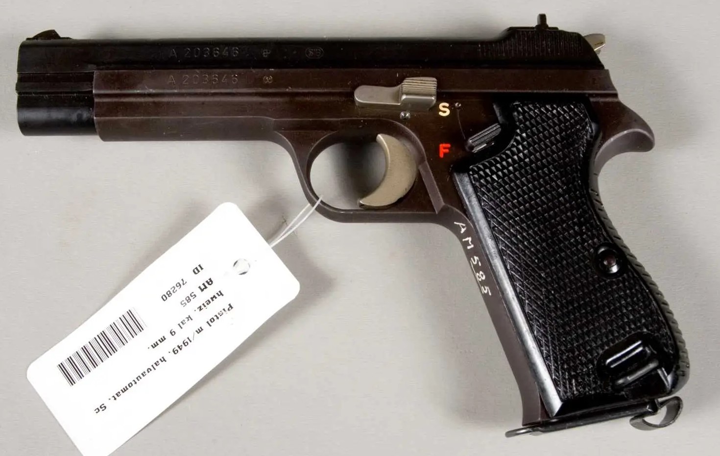 Late Swiss Army SIG P49 pistol with matte finish, checkered black grips and serial A 203646 on slide and frame
